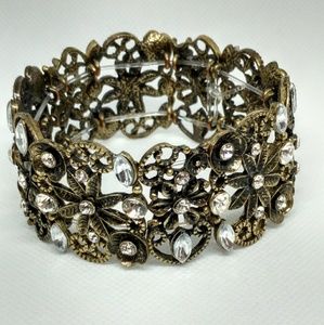 Bronze tone and rhinestone stretch bracelet floral